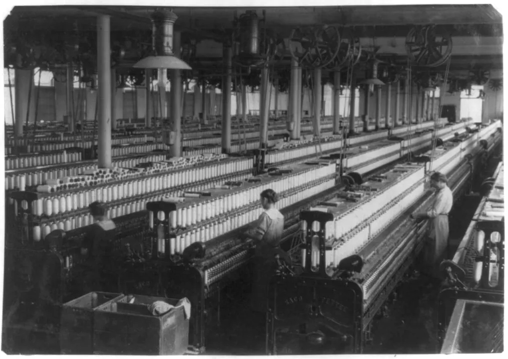 The spinning room of a cotton mill, rows of spindles