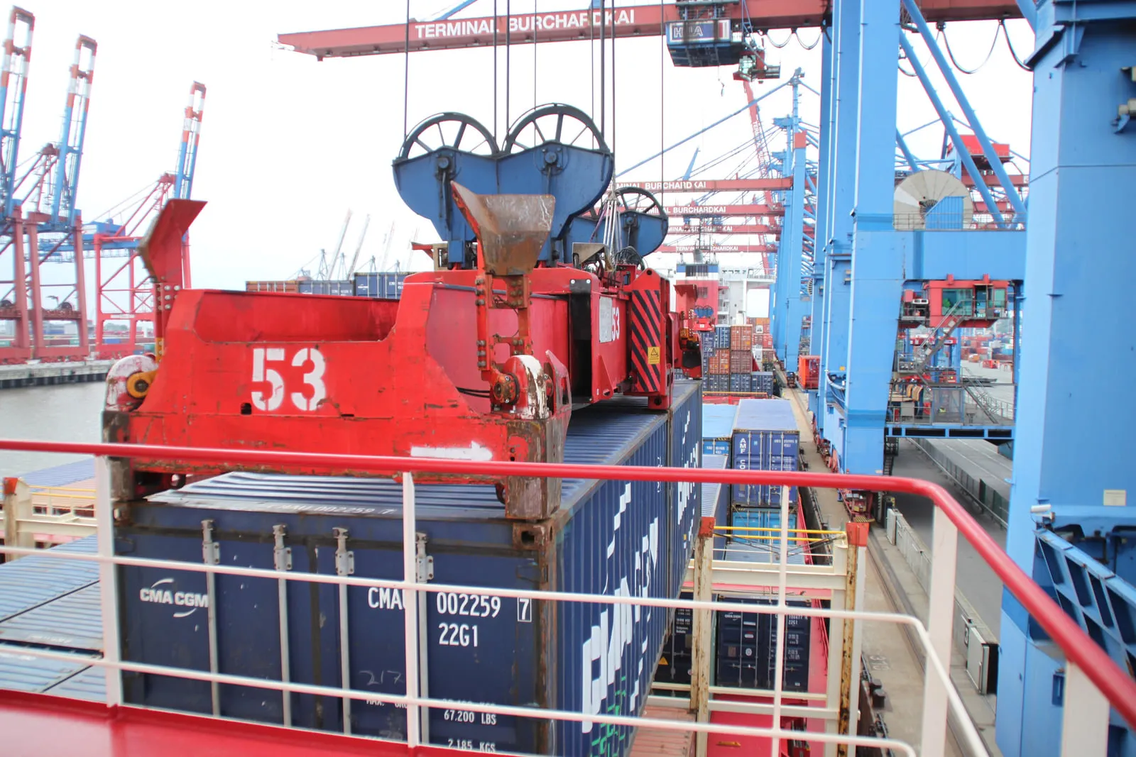 Containers being loaded at the Burchardkai terminal in Hamburg