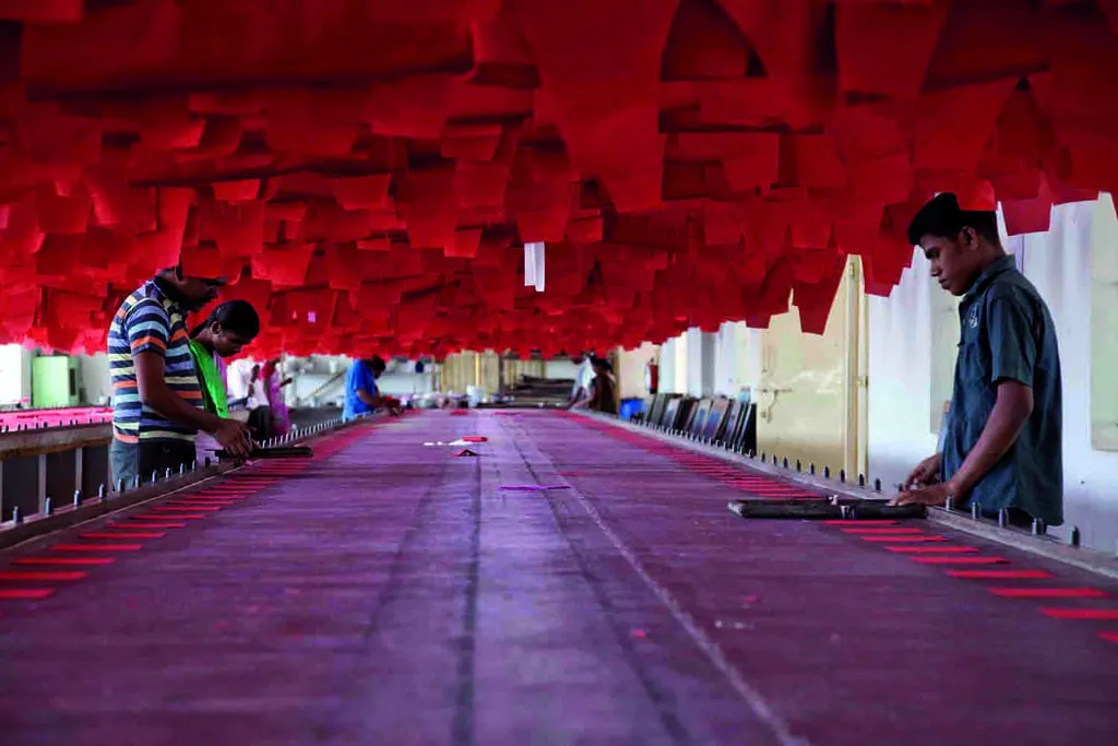 Workers on the floor of an Indian textile and fashion factory