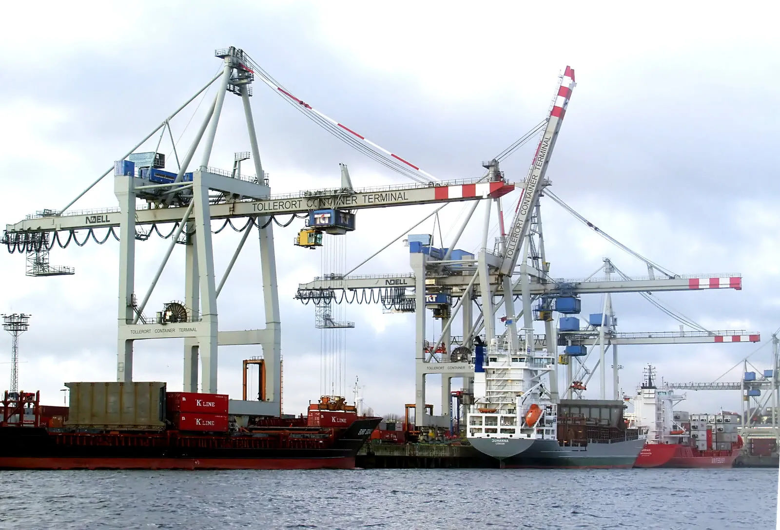 Container terminal in the Port of Hamburg, gantry cranes over stacked containers